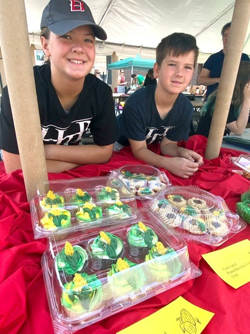 Kids showing baked goods at fair